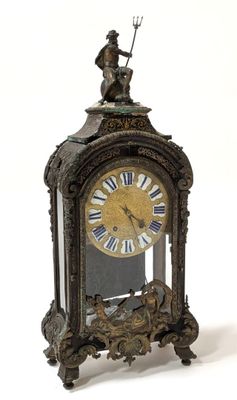 a clock with a man on top of it on a white background