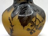 a vase that has a black and yellow design on it