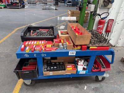 a blue cart with tools on it in a parking lot