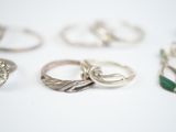 many different types of rings on a white surface