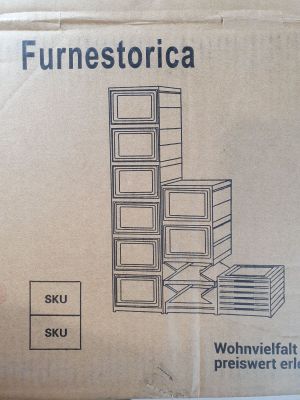 cardboard box with a drawing of a refrigerator inside of it