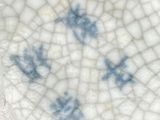 a white plate with a blue design on it