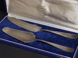 three forks and a knife in a blue case