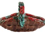 a brown basket with a green handle on a white background