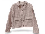 the jacket is beige and black with buttons on the front