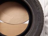 tire on a cardboard box next to a cardboard box with a piece of cardboard