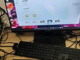 a desktop computer sitting on a desk with a keyboard and mouse