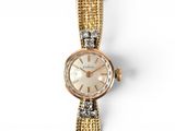an image of a woman ' s wrist watch on a white background