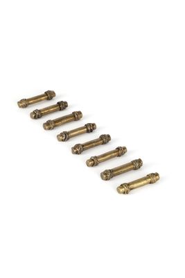 a set of six brass screws on a white background