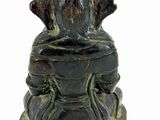 a statue of a buddha sitting on a pedestal
