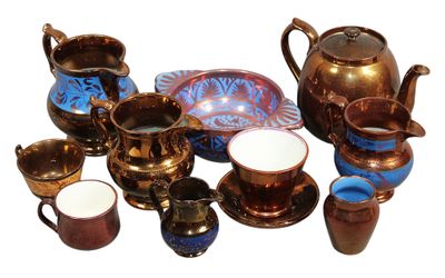 many different types of teapots and cups on the table