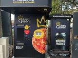 a vending machine with a crown on top of it