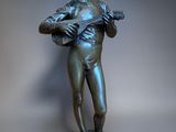 bronze statue of a boy with a mandolin