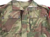 an image of a military jacket with red sleeves and a camouflage pattern