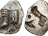 a silver coin with an image of a man and a woman on it