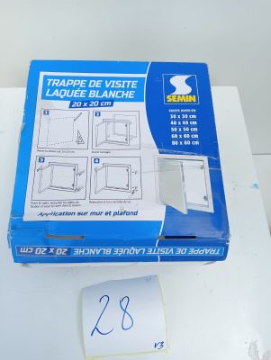 a box of tape on a table with a piece of paper on it