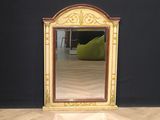 a mirror that is sitting on the floor in a room