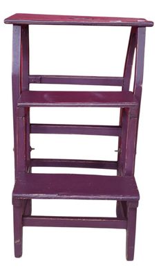 purple wooden shelf with three shelves on each side