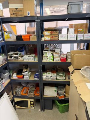 a room filled with lots of boxes and shelves