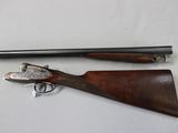 an old gun with a wooden handle and a long barrel