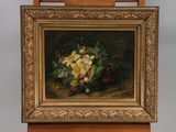 painting of a still life of flowers in a gold frame on a wooden easel