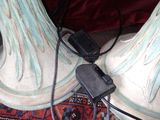 two lamps that are connected to a charger on a rug