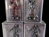 three boxes of action figures of a man and a woman in armor