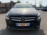 the front of a black mercedes cla parked in a parking lot