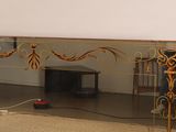 a large mirror with a design on it in a room