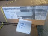 a cardboard box with a sign on it sitting on a carton