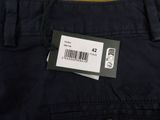 the back of a pair of black pants with a barcode on it