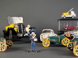 many toy cars that are lined up on a table