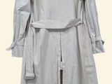 the coat is white and has a long belt on it