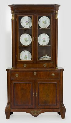 an antique china cabinet with a glass door