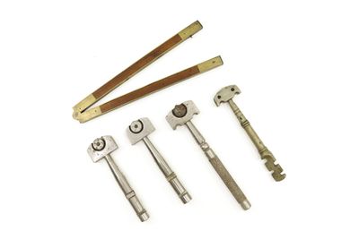 a group of tools that are sitting on top of a white surface