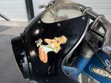 a motorcycle that has a helmet on the back of it