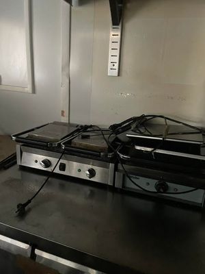 a black counter top with a bunch of appliances on it