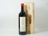 a bottle of wine sitting next to a wooden box