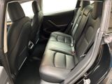 the back seats of a car are empty and the passenger seat is empty