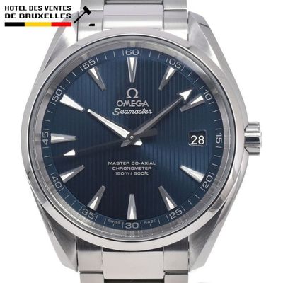 an image of a close up of a watch with a blue dial