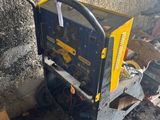 a small machine that is sitting in the corner of a room