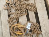 a wooden pallet with a bunch of chains on it
