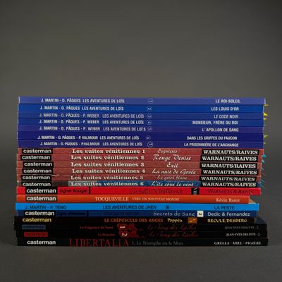 many books stacked on top of each other on a table