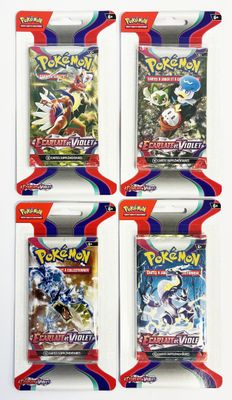 quatre paquets de cartes à collectionner Pokémon dans un lot