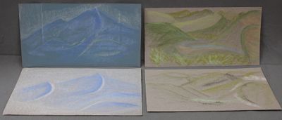four paintings of mountains are displayed on a table
