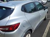 a silver car that is parked in a parking lot