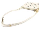 a white purse with stars on it sitting on a white surface