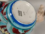 a close up of a vase on a table