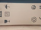 a cardboard box sitting on top of a wooden table