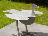 a white bird that is sitting on a table